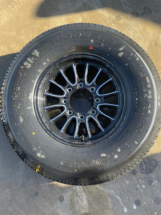 ST/235/80R16 W/RIM W/TIRE FEE 5$